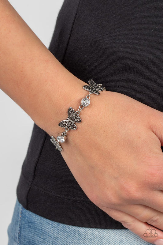 Has a WING to It bracelet.